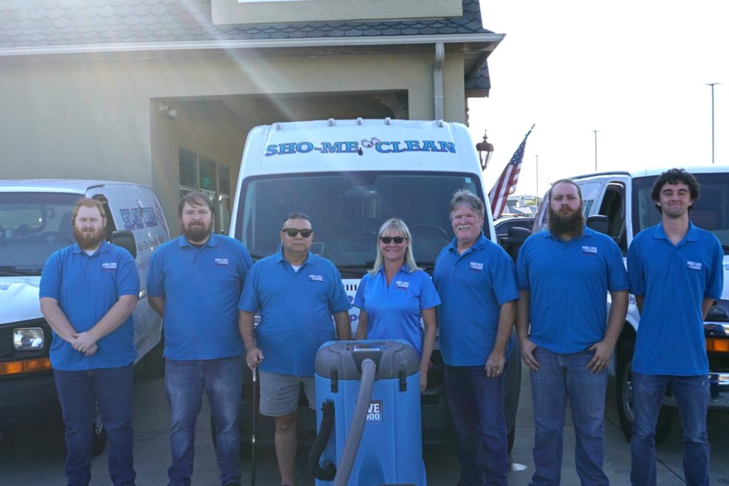 Sho-Me Clean Duct Cleaning staff posing in front of company vans - Branson, MO